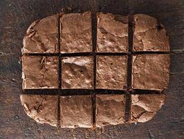 baked  chocolate brownie pie is cut into squares photo