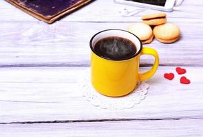 Coffee in a yellow mug photo