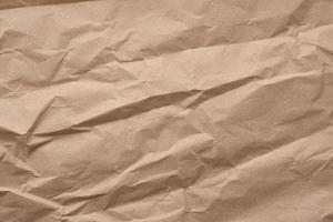 fragment of crumpled blank sheet of brown wrapping kraft paper photo