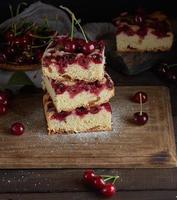 square biscuit slices of a pie with cherries photo