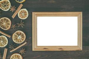 Empty wooden frame on a brown surface photo