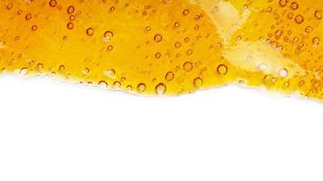 cannabis golden wax resin and white background with place for text photo