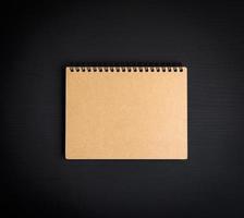 blank notepad with brown sheets photo