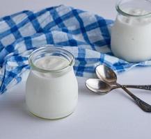 glass jars with homemade yogurt photo