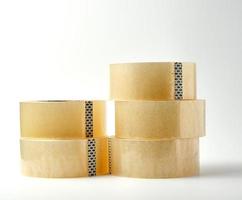 stack of transparent adhesive tape on a white background, close up photo