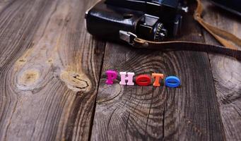 Multicolored wooden letters on a gray surface photo