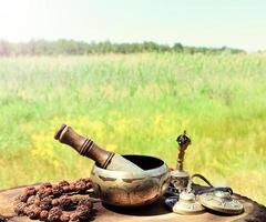 Singing a copper bowl and religious items photo