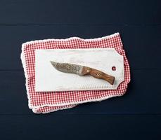 empty white wooden rectangular cutting board and knife photo