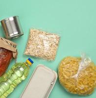 various products, pasta, sunflower oil in a plastic bottle and preservation photo