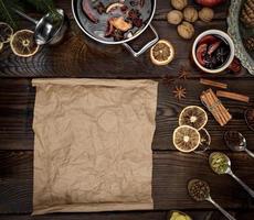 empty scroll of brown paper and ingredients for mulled wine photo