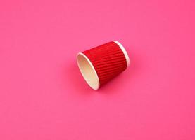 red paper cup with corrugated edges for hot drinks photo