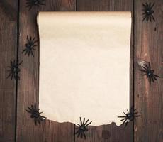 roll of untwisted brown paper on a wooden background photo