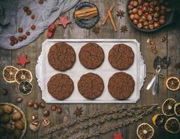 baked round chocolate chip cookies on a silver plate photo