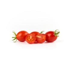 bunch of red ripe cherry tomatoes on a white background