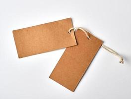 empty paper brown tag on the rope, white background photo