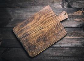 empty very old brown wooden kitchen cutting board photo