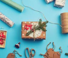 roll of wrapping paper, decor, spruce branches, Christmas toys and boxes photo