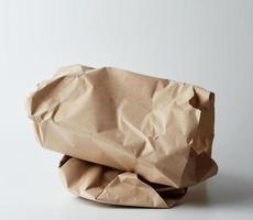 pile of twisted brown sheets of paper on a white background photo