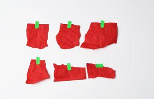 various empty red pieces of paper stuck with green velcro photo