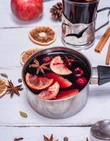 cooked mulled wine in an aluminum container photo