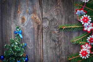 Christmas background with fir branches  on a gray wooden background photo