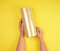 two female hands holding a stack of transparent scotch photo