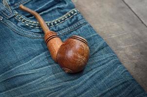 Smoking wooden pipe photo