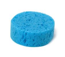round blue bath sponge isolated on white background photo