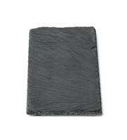 tablero de piedra de pizarra negra rectangular aislado sobre fondo blanco, utensilios para servir comida foto