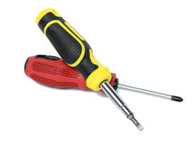 Screwdriver with a rubber handle on a white isolated background photo