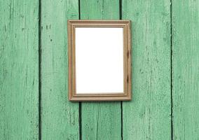 empty wooden frame hanging on wooden wall photo