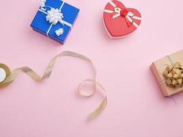 square gift boxes decorated with ribbons and bows photo