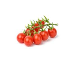 red ripe tomatoes on a green branch on a white background, healthy vegetable, close up