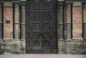 entrance brown wooden door to the temple photo