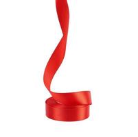 curled red satin ribbon isolated on white background photo