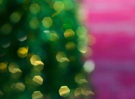 Blurred background Christmas tree on a pink background photo