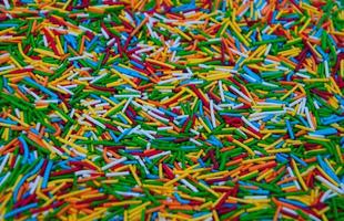 Colorful candy sprinkles heap photo