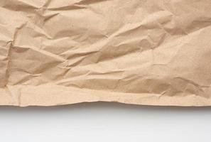 piece of crumpled blank sheet of brown wrapping paper photo