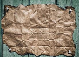 Burnt brown crumpled sheet of paper photo
