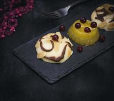 panna cotta on a black background photo