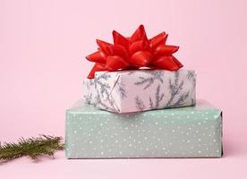 stack of colored paper wrapped gift boxes photo