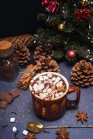 hot chocolate with marshmallow slices in a brown ceramic mug photo