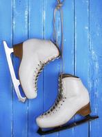 pair of white leather female skates for figure skating photo