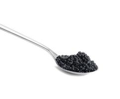 black paddlefish caviar in a metal spoon on a white isolated background photo