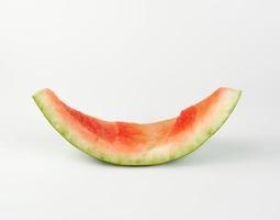 stub of red ripe round watermelon on a white background photo