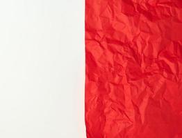 crumpled red  paper on a white background photo