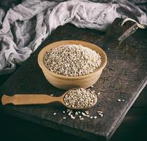 a grain of wheat in a wooden bowl photo