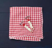 devices for making ravioli on a red and white textile kitchen napkin photo