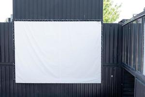 empty white screen for showing a movie, on the street photo