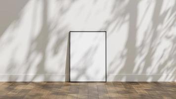 Frame poster mockup on wooden floor with white wall and sunlight shadow overlay photo